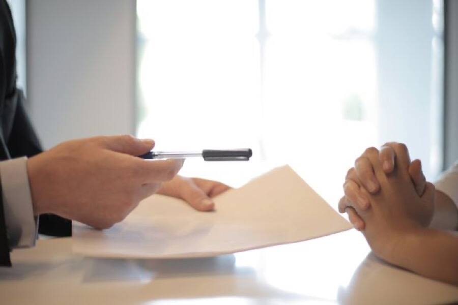Signing a partnership agreement on an office desk